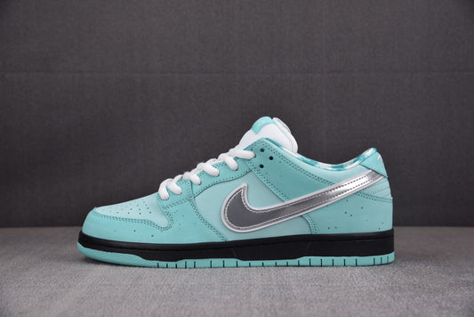 Nike SB Dunk Tiffany Lobster sneaker with white laces on a dark background